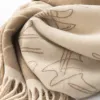 The beige cat-patterned pure cotton scarf is warm, fashionable and versatile for autumn and winter Application Scenario